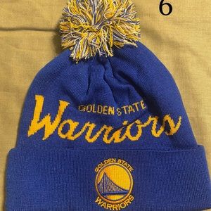 Golden State Warriors embroidered on front and Mitchell & Ness Brand
Pom on top